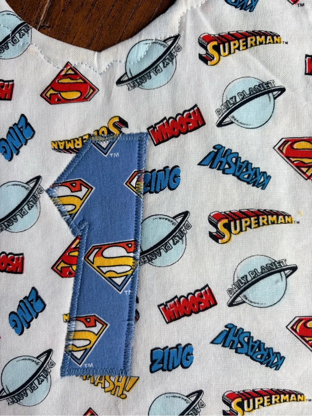 DC Comics Superman White Bib with Blue and Red Accents